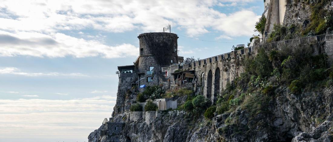 Charming view of historic architecture on the cliffside of Italy's Amalfi Coast.