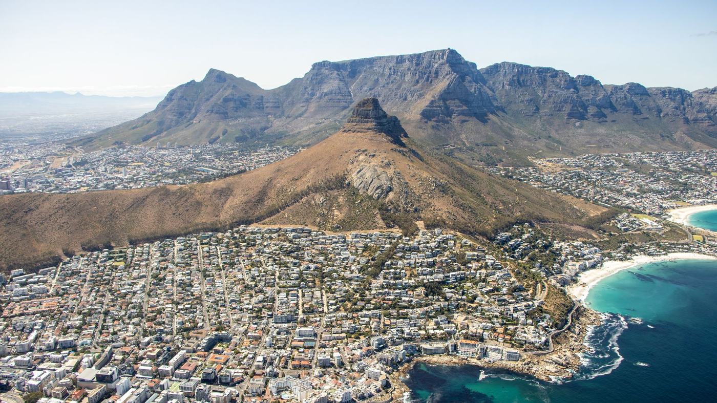 Breathtaking aerial view of Cape Town with Table Mountain and coastline.