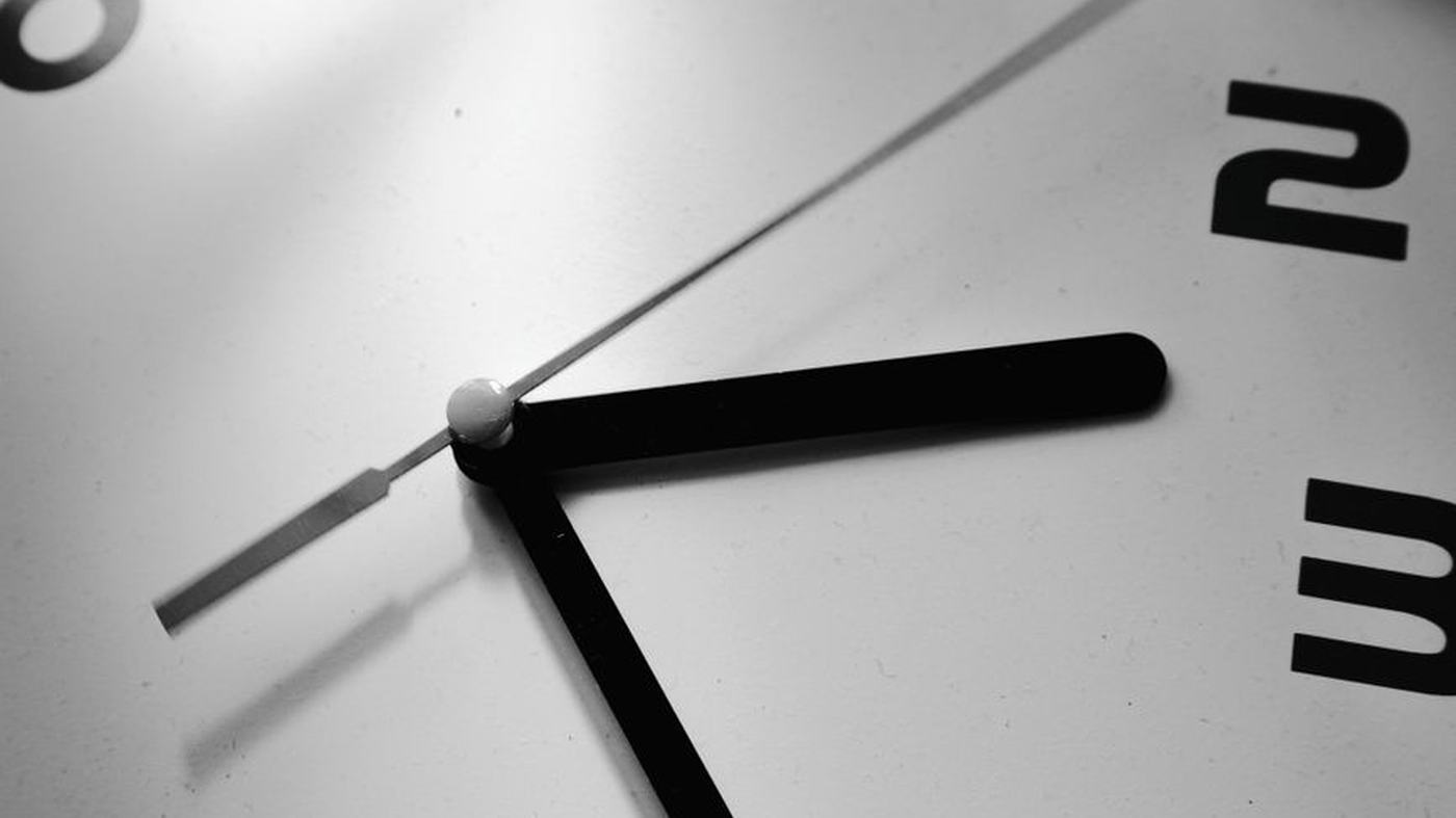 Detailed black and white photograph of a quartz clock face.